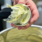 Photo of cream being put into the jar