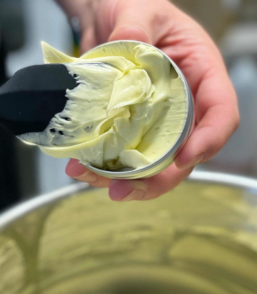 Photo of cream being put into the jar
